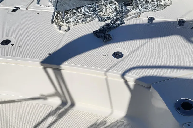 Slide: The Image of 2024 Boston Whaler 210 Montauk deck with rope and shadow details. - 20