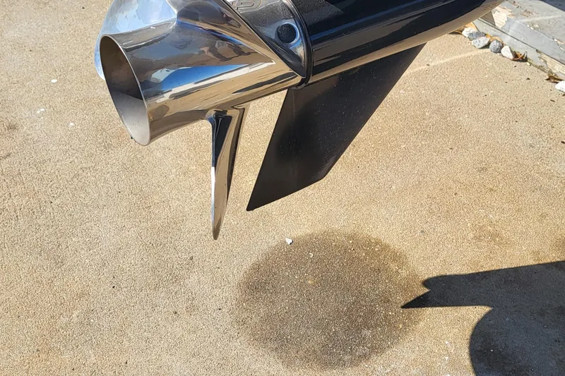 Slide: The Image of Close-up of a 2024 Boston Whaler 210 Montauk boat propeller on concrete. - 7