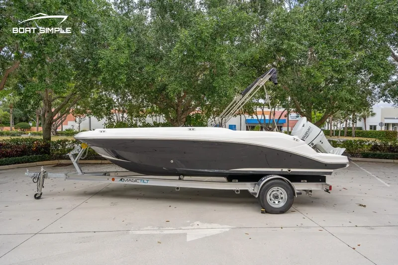Slide: The Image of 2021 Hurricane SunDeck Sport 205 OB boat on trailer, parked outdoors. - 4