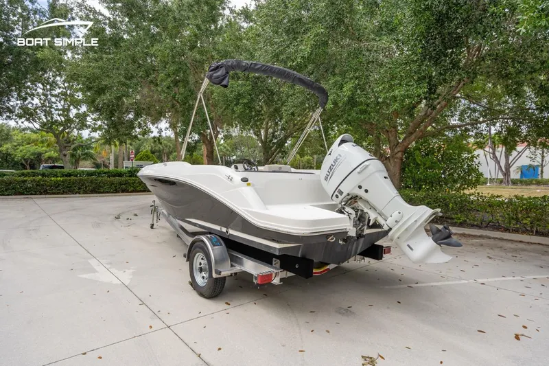 Slide: The Image of 2021 Hurricane SunDeck Sport 205 OB boat on trailer, parked outdoors. - 5