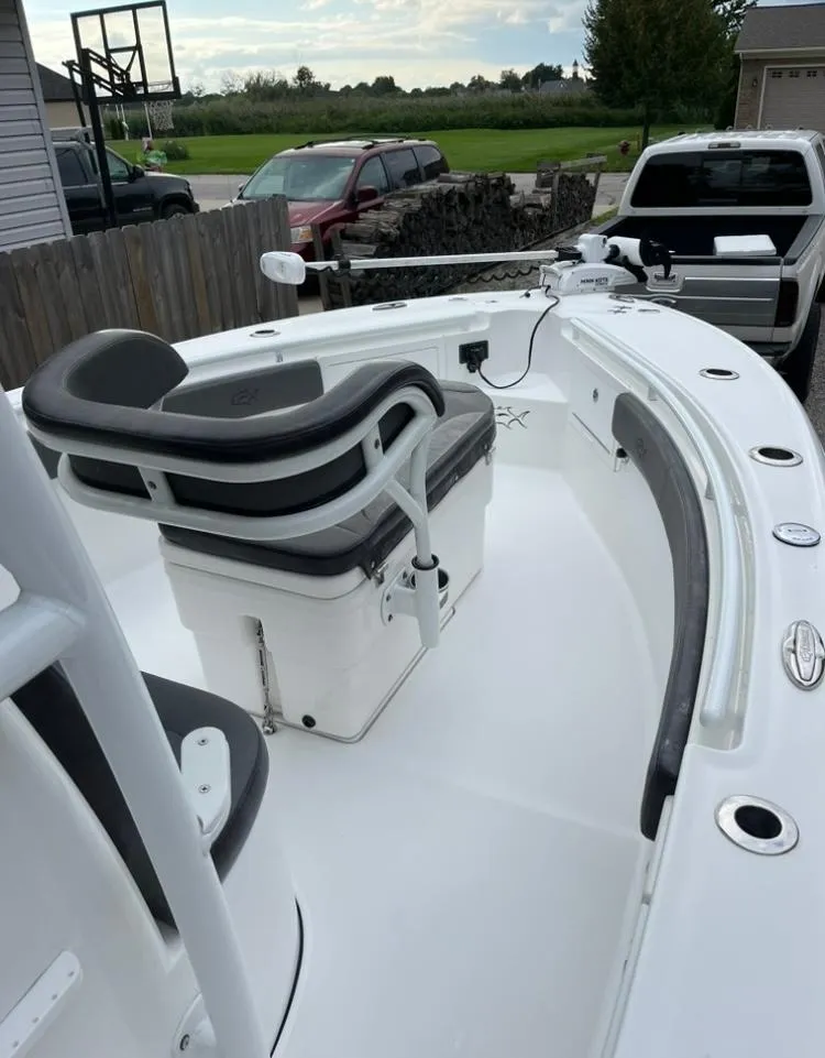 Slide: The Image of 2020 Crevalle 26 HBW boat with seating, parked in a driveway. - 13