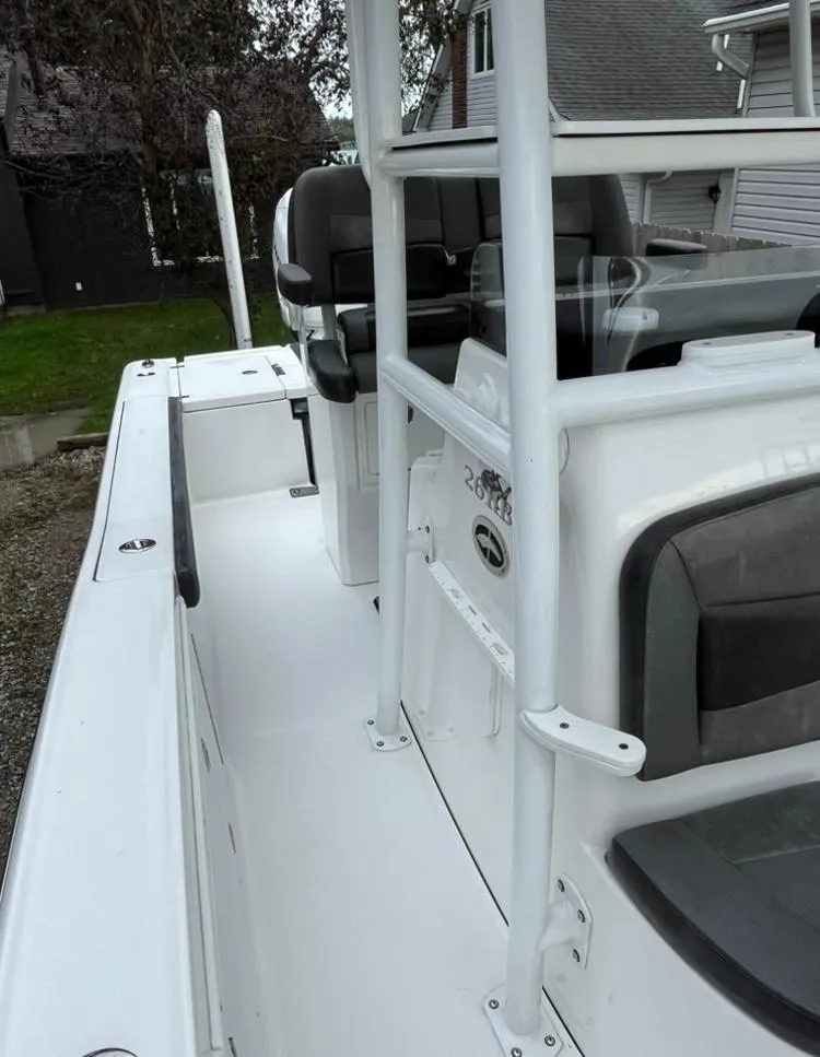 Slide: The Image of 2020 Crevalle 26 HBW boat with sleek white deck and seating. - 17