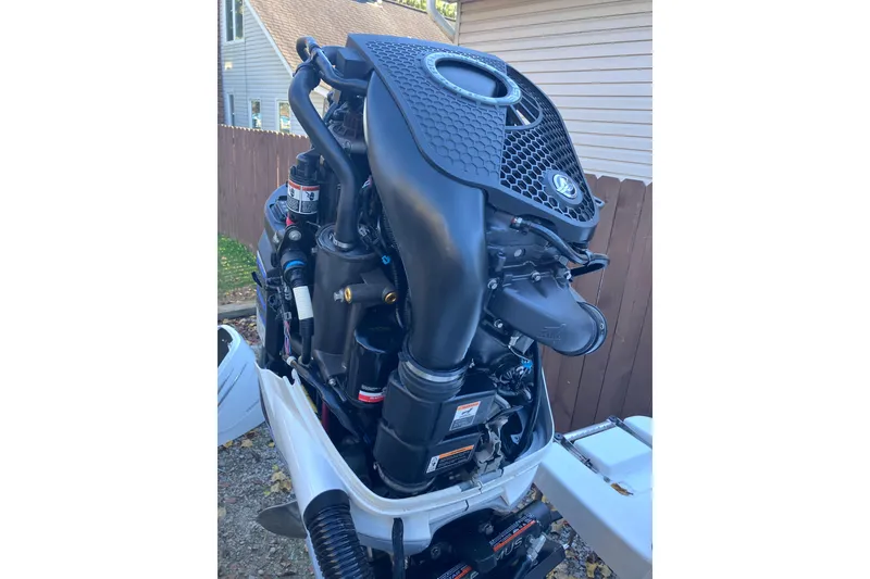 Slide: The Image of 2020 Crevalle 26 HBW boat engine, detailed view, outdoors. - 21