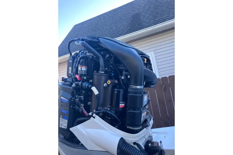 Slide: The Image of 2020 Crevalle 26 HBW boat engine, detailed view with components and wiring. - 24