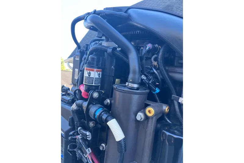 Slide: The Image of Close-up of a 2020 Crevalle 26 HBW boat engine components and wiring. - 26