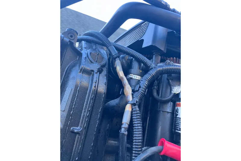 Slide: The Image of Close-up of 2020 Crevalle 26 HBW engine components and wiring. - 27