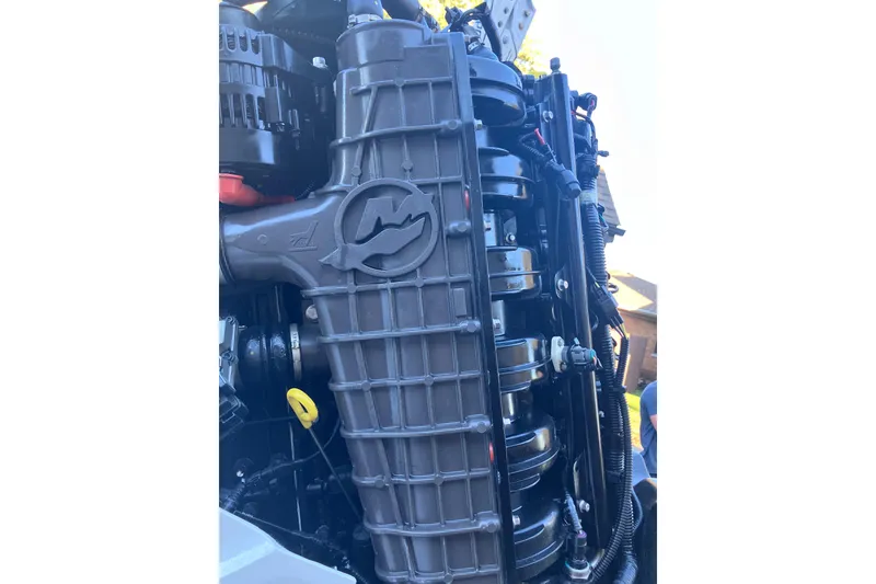 Slide: The Image of Close-up of a 2020 Crevalle 26 HBW boat engine, showcasing intricate mechanical details. - 29