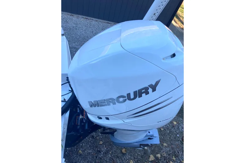 Slide: The Image of White Mercury outboard motor on a 2020 Crevalle 26 HBW boat. - 33