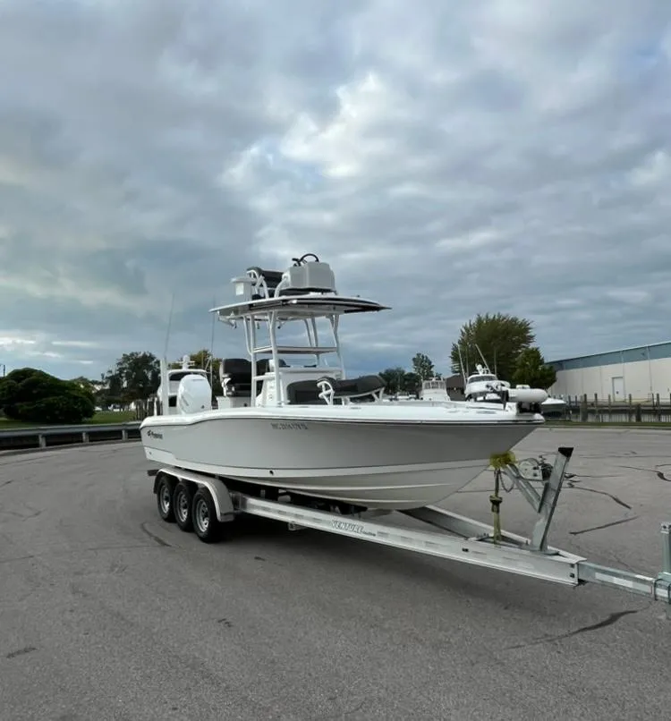 Slide: The Image of 2020 Crevalle 26 HBW boat on trailer under cloudy sky. - 5