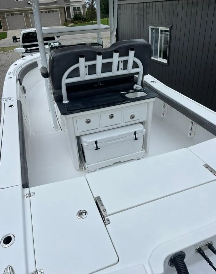 Slide: The Image of 2020 Crevalle 26 HBW boat interior with seating and storage compartments. - 7