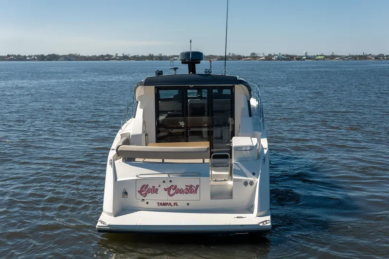 Slide: The Image of 2019 Carver C43 Coupe yacht on calm water, rear view, Tampa, FL. - 6