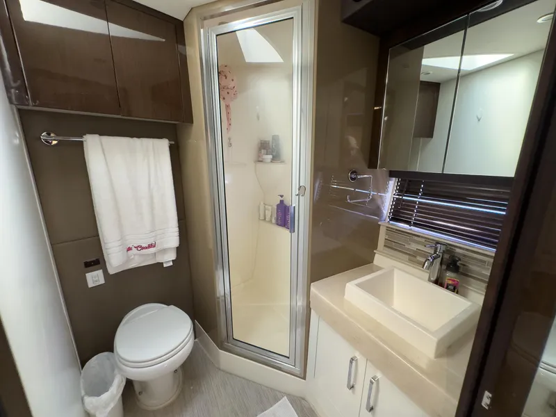 Slide: The Image of Modern bathroom in a 2019 Carver C43 Coupe with shower, sink, and toilet. - 22