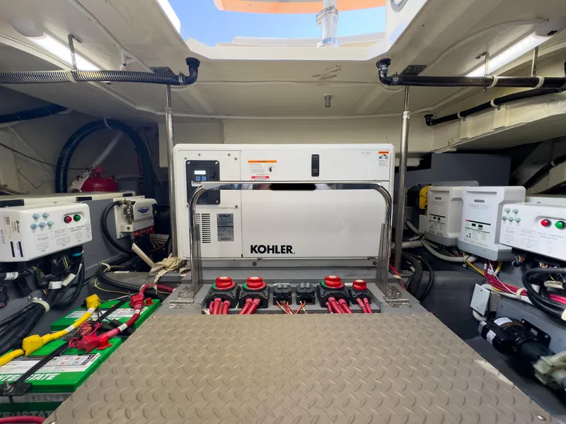 Slide: The Image of Engine room of a 2019 Carver C43 Coupe with Kohler generator and electrical systems. - 29