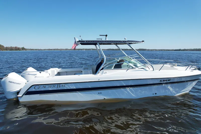 Slide: The Image of 2004 Glacier Bay Renegade 2640 boat on calm water, side view. - 11