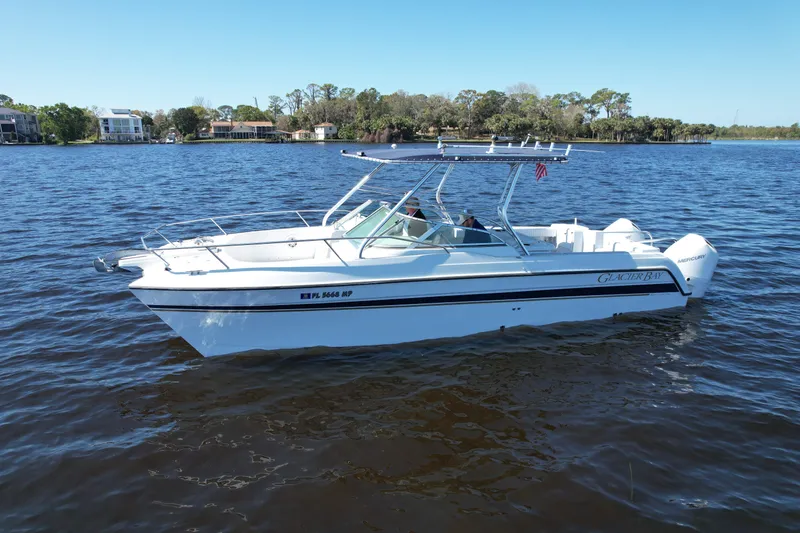 Slide: The Image of 2004 Glacier Bay Renegade 2640 boat on a calm lake. - 17