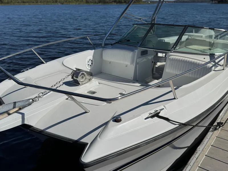 Slide: The Image of 2004 Glacier Bay Renegade 2640 boat docked on calm water. - 19