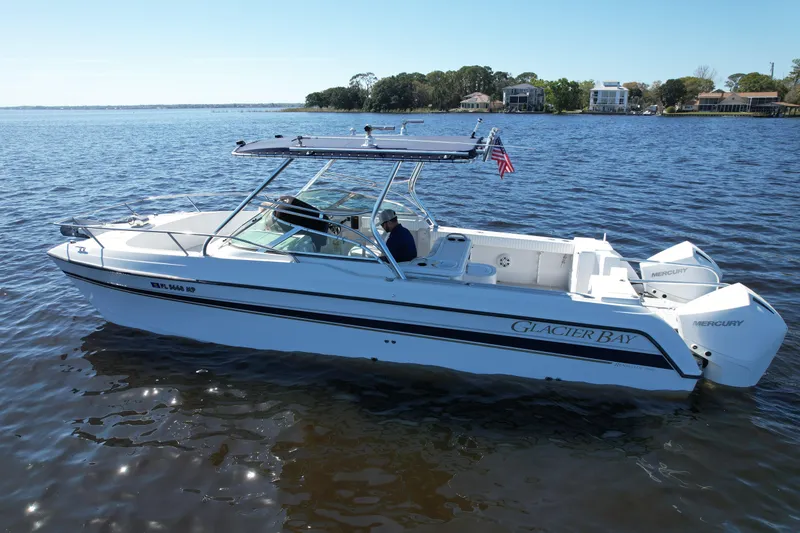 Slide: The Image of 2004 Glacier Bay Renegade 2640 boat on calm water, featuring twin Mercury engines. - 3