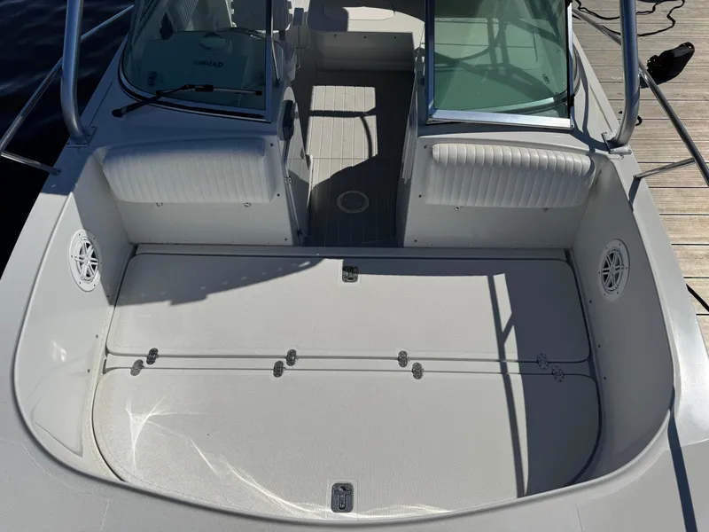 Slide: The Image of 2004 Glacier Bay Renegade 2640 boat interior with spacious deck and seating. - 35