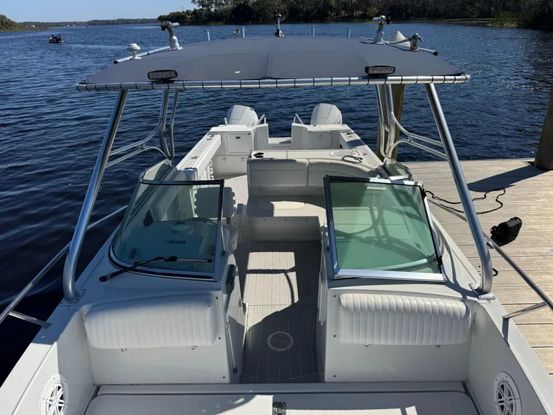 Slide: The Image of 2004 Glacier Bay Renegade 2640 boat docked on a sunny day by the water. - 36