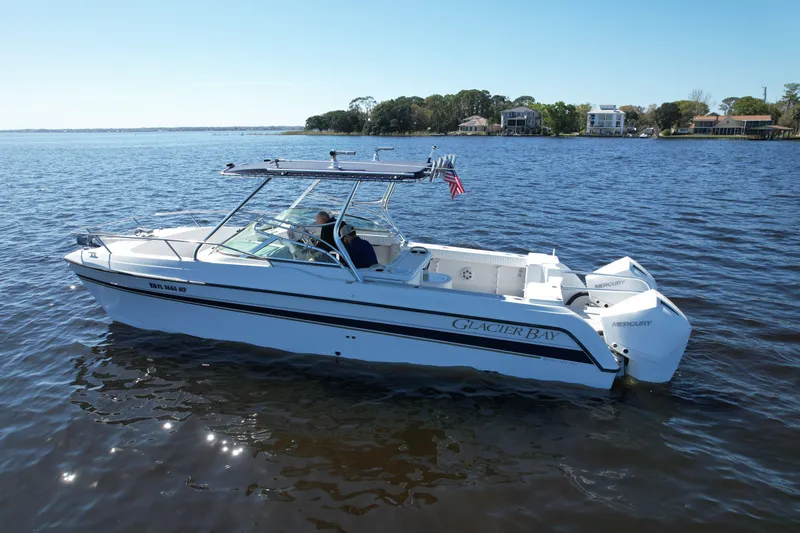 Slide: The Image of 2004 Glacier Bay Renegade 2640 boat on calm water, side view. - 4