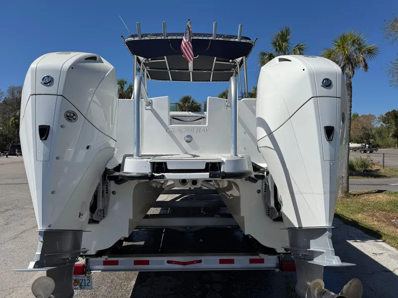 Slide: The Image of 2004 Glacier Bay Renegade 2640 boat with dual engines on a trailer. - 42