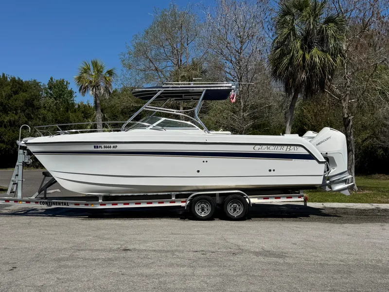 Slide: The Image of 2004 Glacier Bay Renegade 2640 boat on trailer, parked outdoors. - 49
