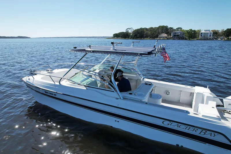 Slide: The Image of 2004 Glacier Bay Renegade 2640 boat cruising on a sunny day. - 5