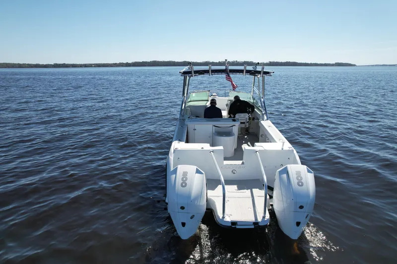 Slide: The Image of 2004 Glacier Bay Renegade 2640 boat cruising on open water. - 8