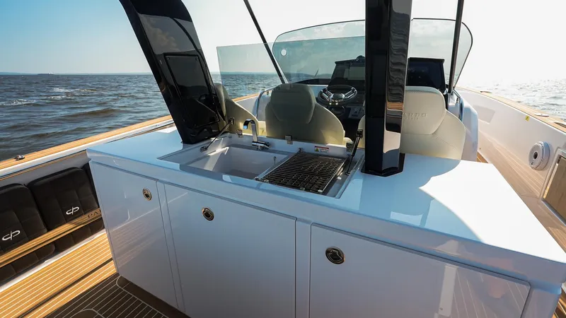 Slide: The Image of 2025 Pardo Yachts 38 Walkaround with sleek outdoor kitchen on deck. - 17