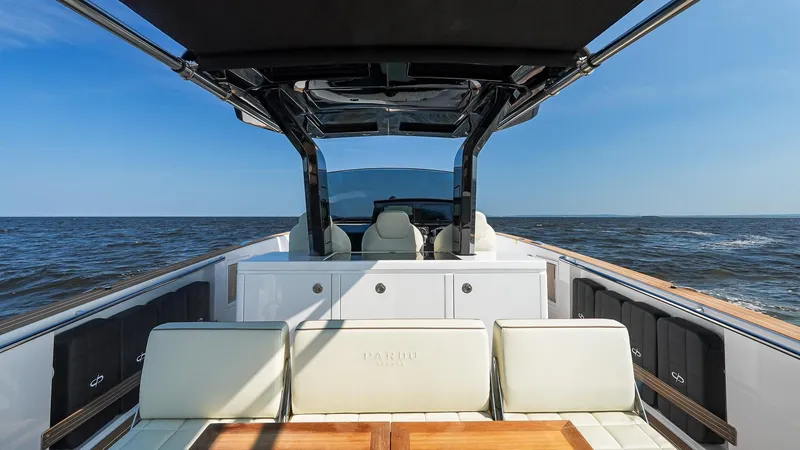 Slide: The Image of 2025 Pardo Yachts 38 Walkaround on open water, featuring luxurious seating and sleek design. - 18