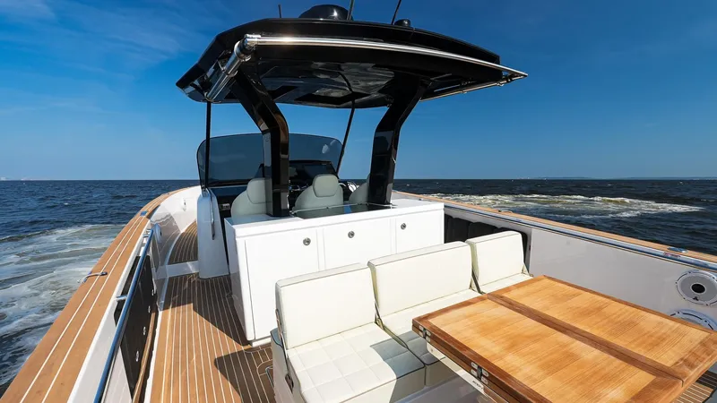 Slide: The Image of 2025 Pardo Yachts 38 Walkaround on open water, featuring sleek design and luxury seating. - 19