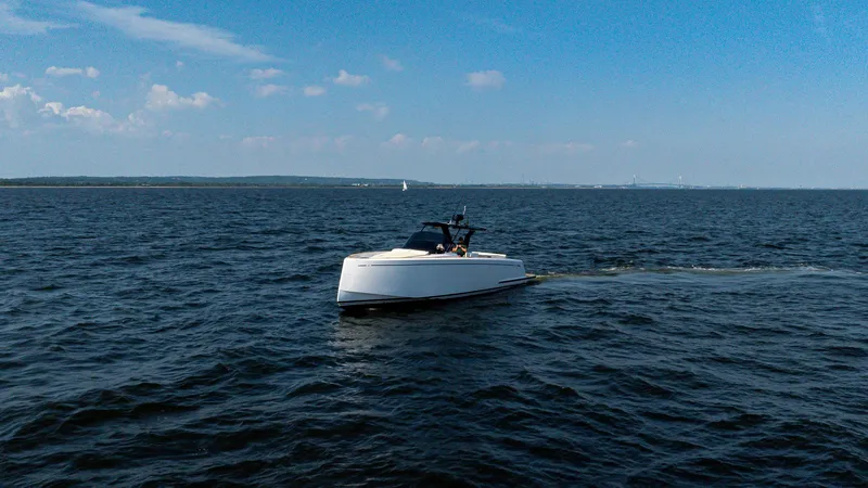 Slide: The Image of 2025 Pardo Yachts 38 Walkaround cruising on open water under a clear blue sky. - 2