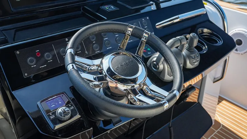 Slide: The Image of Steering wheel and controls of 2025 Pardo Yachts 38 Walkaround. - 22