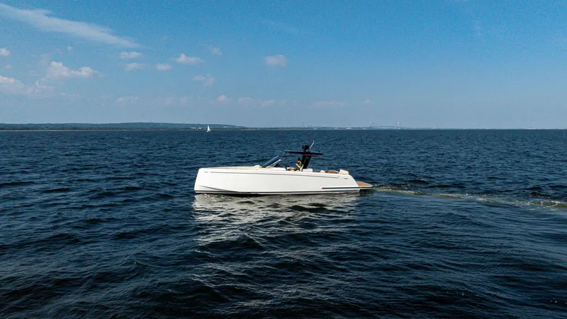 Slide: The Image of 2025 Pardo Yachts 38 Walkaround cruising on open water under clear blue skies. - 3