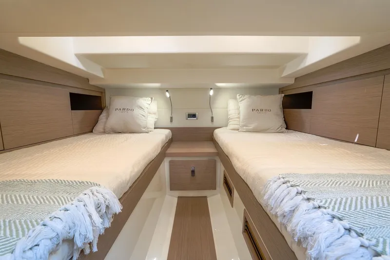 Slide: The Image of 2025 Pardo Yachts 38 Walkaround cabin with twin beds and modern interior design. - 30