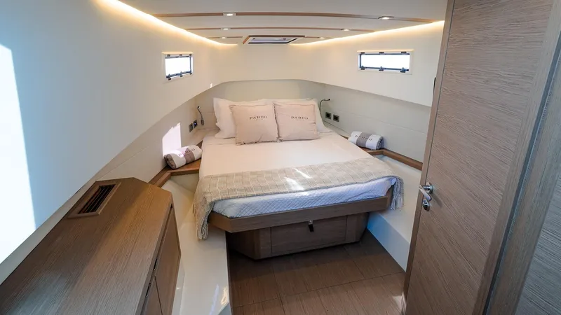 Slide: The Image of 2025 Pardo Yachts 38 Walkaround cabin with modern interior and cozy bed. - 31