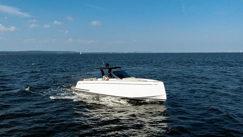 Slide: The Image of 2025 Pardo Yachts 38 Walkaround cruising on open water under clear skies. - 6