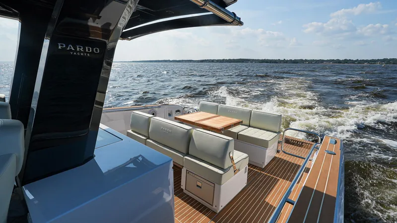 Slide: The Image of 2025 Pardo Yachts 38 Walkaround cruising on open water, featuring elegant deck seating. - 9