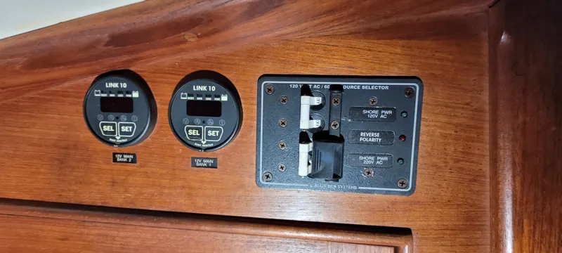 Slide: The Image of Control panel of a 1980 Shannon 38 Ketch sailboat with gauges and switches. - 24