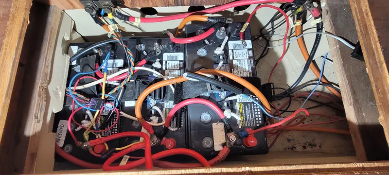 Slide: The Image of Battery compartment of a 1980 Shannon 38 Ketch with wiring and connections. - 28
