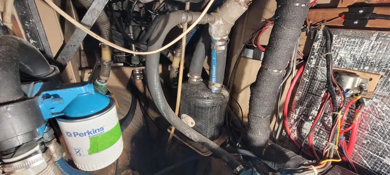 Slide: The Image of Engine compartment of a 1980 Shannon 38 Ketch with Perkins filter and wiring. - 30