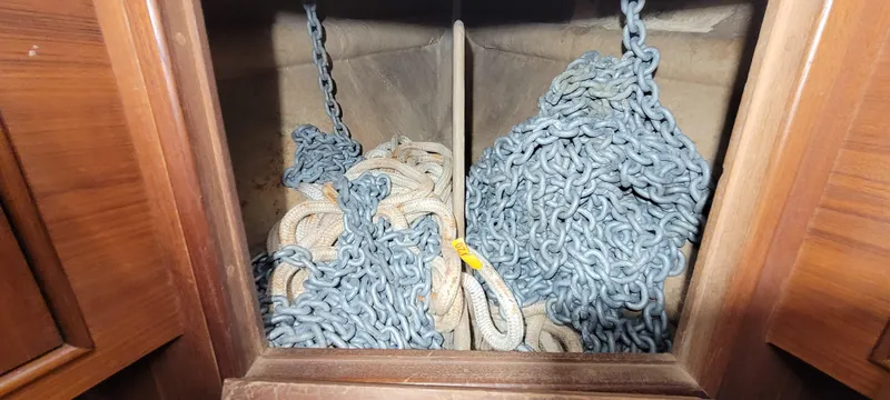 Slide: The Image of Anchor chains and ropes stored in a compartment of a 1980 Shannon 38 Ketch sailboat. - 35