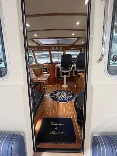 Slide: The Image of Interior of 2011 Sabre 40 Sedan yacht with elegant wood finish and nautical decor. - 15