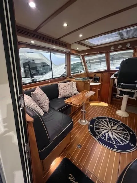 Slide: The Image of 2011 Sabre 40 Sedan interior with elegant wood finish and comfortable seating. - 16