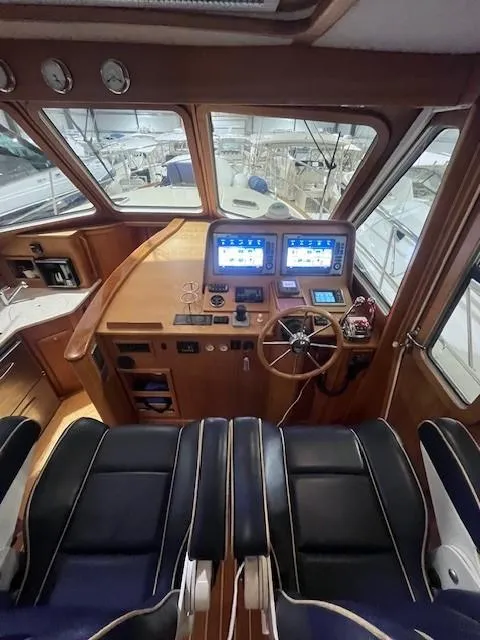 Slide: The Image of Interior of 2011 Sabre 40 Sedan yacht with modern navigation equipment and leather seating. - 24