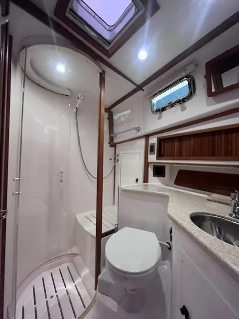 Slide: The Image of 2011 Sabre 40 Sedan bathroom with shower, toilet, and sink. - 44