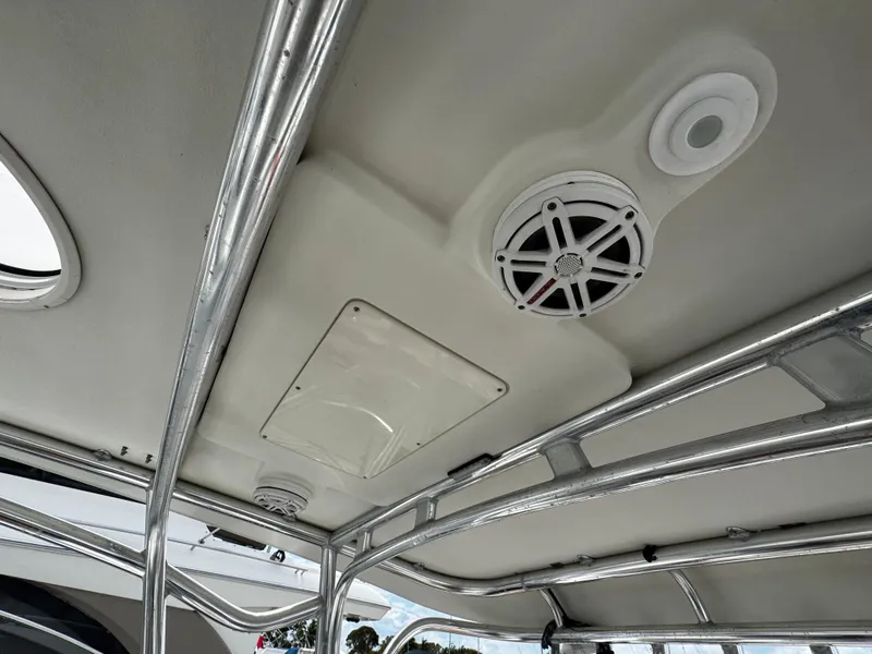 Slide: The Image of 2008 Hydra-Sports Vector 3300 VX boat interior ceiling with speaker and metal framework. - 11