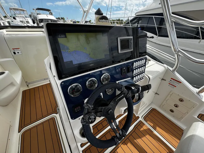 Slide: The Image of 2008 Hydra-Sports Vector 3300 VX helm with navigation display and controls. - 13