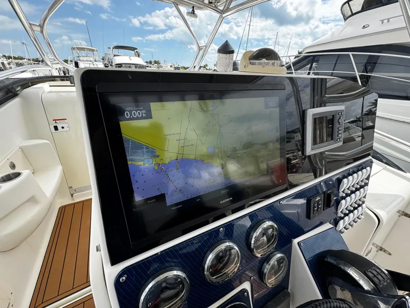 Slide: The Image of 2008 Hydra-Sports Vector 3300 VX boat dashboard with navigation display. - 14