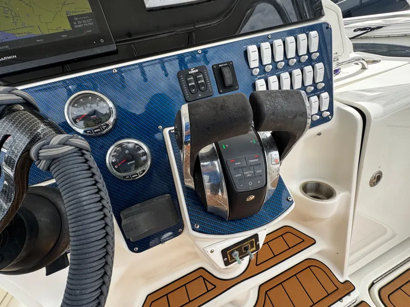 Slide: The Image of Control panel of a 2008 Hydra-Sports Vector 3300 VX boat with gauges and switches. - 18